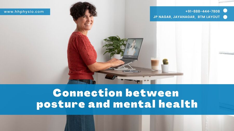 Lady standing working desk with good posture and mental health.