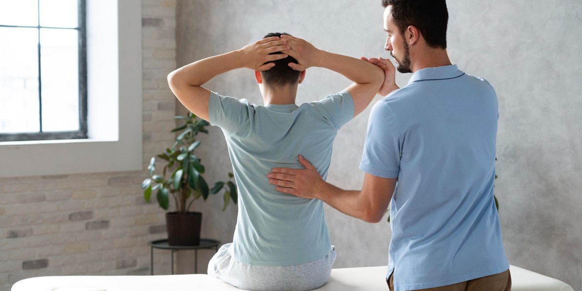 A man taking Back Pain Physiotherapy Treatment